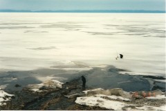 Siberia's incredible scenery - a lone fisherman ice-fishing, Lake Baikal