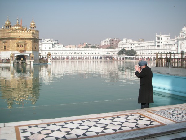 A man prays at the Golden Temple of Amristar; the holiest site for Sikhs