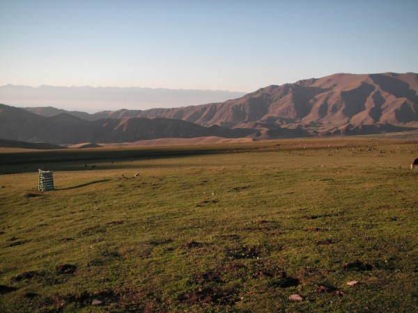 Kyrgyzstan mountains in evening light. Plus toilet.