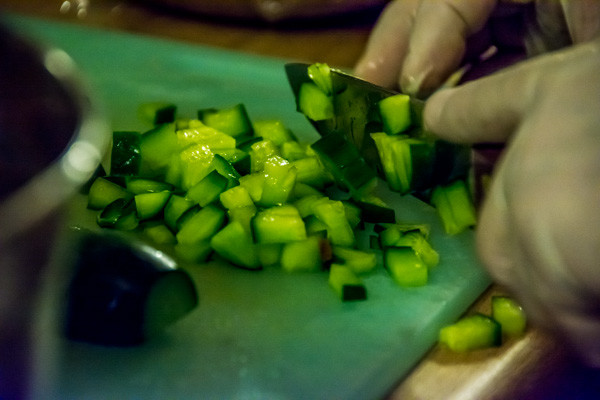 Chopping cucumbers